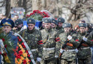 Ukranian soldiers carry the coffin of a comrade, who was killed while defending a radar station from attackers, during his funeral in Kharkiv